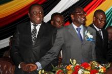 Zimbabwe's President Robert Mugabe (front R) and Prime Minister Morgan Tsvangirai (L) attend a conference of parties and civic society groups reviewing a draft constitution that, if adopted, will lead to Zimbabwe's next election, at a hotel in Harare, October 22, 2012. PHOTO BY REUTERS/Philimon Bulawayo