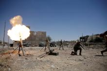 A member of the Iraqi rapid response forces fires a mortar shell against Islamic State militants positions in western Mosul, Iraq, May 31, 2017. PHOTO BY REUTERS/Alkis Konstantinidis