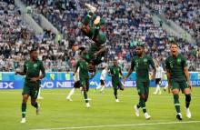 Nigeria's Victor Moses celebrates scoring their first goal with Ahmed Musa, Brian Idowu and William Troost-Ekong. PHOTO BY REUTERS/Toru Hanai