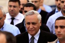 Former Israeli President Moshe Katsav (C) leaves the Supreme Court in Jerusalem after the reading of his verdict, November 10, 2011. PHOTO BY REUTERS/Nir Elias