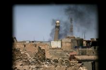 Al-Hadba minaret at the Grand Mosque is seen through a building window in the old city of Mosul, Iraq, June 1, 2017. PHOTO BY REUTERS/Alaa Al-Marjani