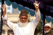 Moulana Motiur Rahman Nizami, chief of the Jamaat-e-Islami, Bangladesh's biggest Islamic Political Party and an alliance of the ruling Bangladesh Nationalist Party, waves to his supporters during a rally protesting against Western newspapers that published cartoons on Prophet Mohammad in Dhaka, February 11, 2006. PHOTO BY REUTERS/Rafiqur Rahman