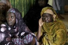 Mourners look on as they pay their respects during a visit to the family of Bilikisu Yusuf, one of the victims of the stampede which occurred in Saudi Arabia's Mina, in Kaduna, Nigeria, September 26, 2015. PHOTO BY REUTERS/Afolabi Sotunde