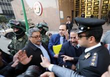 Samir Abdel Azem (C) Egyptian Lawyer of Ghad Party chairperson Moussa Mostafa Moussa carries the presidential candidacy papers in front of the National Election Authority, in Cairo, Egypt, January 29, 2018. PHOTO BY REUTERS/Mohamed Abd El Ghany