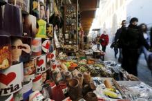 Souvenir mugs featuring Syria's President Bashar al-Assad, Russia's President Vladimir Putin and Lebanon's Hezbollah leader Sayyed Hassan Nasrallah are seen among other items for sale in old Damascus, Syria, February 8, 2016. PHOTO BY REUTERS/Omar Sanadiki