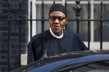 Nigeria's President-elect Muhammadu Buhari departs after meeting with Britain's Prime Minister David Cameron at Downing Street in London, England, May 23, 2015. PHOTO BY REUTERS/Neil Hall