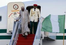 Nigeria's President Muhammadu Buhari (L) arrives on his official plane to attend the upcoming Nuclear Security Summit meetings in Washington, on the tarmac at Joint Base Andrews, Maryland, March 30, 2016. PHOTO BY REUTERS/Jonathan Ernst