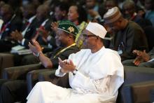 Nigeria's President Muhammadu Buhari and Minister of Budget and National Planning Udo Udoma Udo attend the 22nd Nigerian Economic Summit (NESG 2016) in Abuja, Nigeria, October 10, 2016. PHOTO BY REUTERS/Stringer