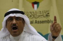 Kuwaiti lawmaker Musallam al-Barrak gestures while speaking to journalists at Parliament's media center in Kuwait City, November 20, 2011. PHOTO BY REUTERS/Hamad I Mohammed