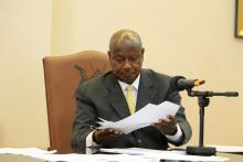 Uganda President Yoweri Museveni signs an anti-homosexual bill into law at the state house in Entebbe, 36 km (22 miles) south west of capital Kampala
