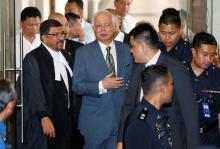 Malaysia's former prime minister Najib Razak walks out of a courtroom in Kuala Lumpur, Malaysia, August 8, 2018. PHOTO BY REUTERS/Lai Seng Sin