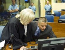 Bosnian Muslim Naser Oric (R) and his lawyer Vasvija Vidovic sit in the courtroom of the International Criminal Tribunal for the former Yugoslavia (ICTY) as he waits for the judgement on his appeal against his war crimes conviction in The Hague, July 3, 2008. PHOTO BY REUTERS/Zoran Lesic