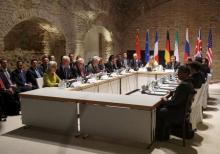 Negotiators of Iran and six world powers face each other at a table in the historic basement of Palais Coburg hotel in Vienna, April 24, 2015. PHOTO BY REUTERS/Heinz-Peter Bader