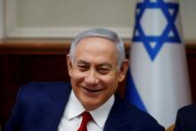 Israeli Prime Minister Benjamin Netanyahu smiles during the weekly cabinet meeting in Jerusalem, December 23, 2018. PHOTO BY REUTERS/Ronen Zvulun