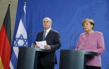 Israeli Prime Minister Benjamin Netanyahu (L) and German Chancellor Angela Merkel address a news conference at the Chancellery in Berlin, Germany, February 16, 2016. PHOTO BY REUTERS/Fabrizio Bensch