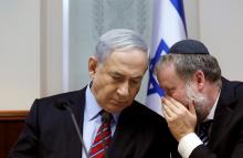 Israel's Prime Minister Benjamin Netanyahu listens to Avichai Mandelblit (R) during the weekly cabinet meeting in Jerusalem, November 16, 2014. PHOTO BY REUTERS/Gali Tibbon