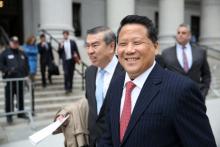 Macau billionaire real estate developer Ng Lap Seng (R), accused of bribing former United Nations General Assembly president John Ashe, exits the Manhattan U.S. District Courthouse in New York, U.S., April 7, 2017. PHOTO BY REUTERS/Ashlee Espinal