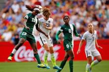 United States defender Meghan Klingenberg (22) and Nigeria defender Ngozi Ebere (23) go up for a header during the second half in a Group D soccer match in the 2015 FIFA women's World Cup at BC Place Stadium, Vancouver, British Columbia, CAN. PHOTO BY USA TODAY Sports/Michael Chow