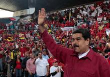 Venezuela's President Nicolas Maduro waves during a pro-government rally with workers of state-run oil company PDVSA, in Barcelona, Venezuela, July 8, 2017. PHOTO BY REUTERS/Miraflores Palace