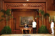 U.S. President Barack Obama signs the official guest book next to President Benigno Aquino of the Philippines at the Malacanang Palace in Manila
