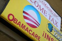 A sign on an insurance store advertises Obamacare in San Ysidro, San Diego, California, U.S., October 26, 2017. PHOTO BY REUTERS/Mike Blake