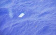 A view of an object floating in the water is seen on a computer screen onboard a Royal New Zealand Air Force (RNAF) plane searching for wreckage from Malaysia Airlines Flight MH370 in the new Indian Ocean search area in this March 28, 2014 still image taken from video. REUTERS
