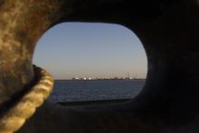 A general view of an oil dock is seen from a ship at the port of Kalantari in Iran