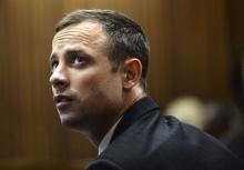 "Blade Runner" Oscar Pistorius sits in the dock in the North Gauteng High Court in Pretoria, in this file picture taken March 4, 2014. PHOTO BY REUTERS/Antoine de Ras
