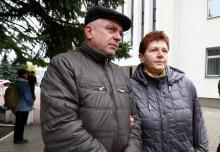 Alexander and Antonina Palchis stand outside a court building during the court hearing of their son Edward in Minsk, Belarus, October 14, 2016. PHOTO BY REUTERS/Vasily Fedosenko