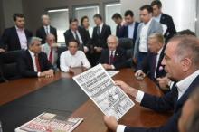 Gursel Tekin, a lawmaker from the main opposition Republican People's Party (CHP) holds a print copy of Sozcu daily newspaper as they visit the publication's headquarters in Istanbul, Turkey, May 19, 2017. PHOTO BY REUTERS/Ziya Koseoglu