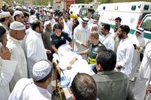 Paramedics rush a victim of a suicide bomb attack at Imam al-Sadeq Mosque, to the Amiri hospital in Al Sharq, Kuwait City, June 26, 2015. PHOTO BY REUTERS/Stringer