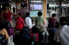 Passengers watch a TV screen broadcasting a news report on North Korea's submarine-launched ballistic missile fired from North Korea's east coast port of Sinpo, at a railway station in Seoul, South Korea, August 24, 2016. PHOTO BY REUTERS/Kim Hong-Ji