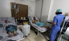 Civilians breathe through an oxygen mask at al-Quds hospital, after a hospital and a civil defence group said a gas, what they believed to be chlorine, was dropped alongside barrel bombs on a neighbourhood of the Syrian city of Aleppo, Syria, early August 11, 2016. PHOTO BY REUTERS/Abdalrhman Ismail