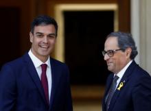 Spain's Prime Minister Pedro Sanchez smiles with pro-independence Catalan leader Quim Torra at the Moncloa Palace in Madrid, Spain, July 9, 2018. PHOTO BY REUTERS/Juan Medina