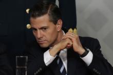 Mexico's President Enrique Pena Nieto looks on during a meeting with lawyers in Mexico City, November 21, 2014. PHOTO BY REUTERS/Tomas Bravo