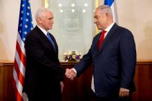 U.S. Vice President Mike Pence shakes hands with Israeli Prime Minister Benjamin Netanyahu during a meeting at the Prime Minister's office in Jerusalem, January 22, 2018. PHOTO BY REUTERS/Ariel Schalit