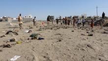 People gather at the site of a suicide bombing in the southern port city of Aden, Yemen, December 18, 2016. PHOTO BY REUTERS/Stringer