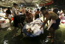 People carry an injured victim from an accidental explosion during a music concert at the Formosa Water Park in New Taipei City, Taiwan, June 27, 2015. PHOTO BY REUTERS/Wu Chia