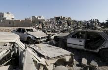 People search for survivors under the rubble of houses destroyed by an air strike near Sanaa Airport, March 26, 2015. PHOTO BY REUTERS/Khaled Abdullah