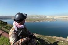 An Iraqi Kurdish Peshmerga stands guard near the Mosul Dam in northern Iraq, February 3, 2016. PHOTO BY REUTERS/Azad Lashkari
