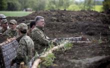 Ukrainian President Petro Poroshenko inspects the construction of fortification in Donetsk region, Ukraine, June 11, 2015. PHOTO BY REUTERS/Mikhail Palinchak