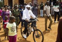 President Pierre Nkurunziza rides a bicycle as he heads to the venue where he voted in at a polling station in his rural home in Ngozi during a parliamentary election in Burundi, June 29, 2015. PHOTO BY REUTERS/Stringer
