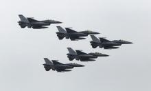 Taiwan Air Force's F-16 fighter jets fly during the annual Han Kuang military exercise at an army base in Hsinchu, northern Taiwan, July 4, 2015. PHOTO BY REUTERS/Patrick Lin