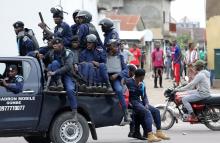 Police sit in a pickup vehicle in front of Notre Dame Cathedral in Kinshasa, Democratic Republic of Congo, February 25, 2018. PHOTO BY REUTERS/Goran Tomasevic