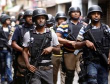 Security personnel leave the site after a police operation on militants on the outskirts of Dhaka, Bangladesh, July 26, 2016. PHOTO BY REUTERS/Mohammad Ponir Hossain