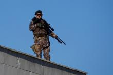 A member of police special forces stands guard during a trial for soldiers accused of attempting to assassinate Turkish President Tayyip Erdogan on the night of the failed last year's July 15 coup, in Mugla, Turkey, October 4, 2017. REUTERS/Osman Orsal