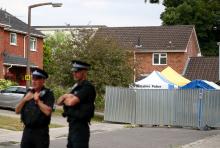 Police officers stand on duty outside Sergei Skripal's home in Salisbury, Britain, July 19, 2018. PHOTO BY REUTERS/Hannah McKay