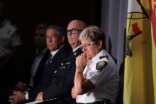 Fredericton Police Chief Leanne Fitch (R) listens to questions from reporters while addressing a news conference about shooting in Fredericton, New Brunswick, Canada, August 10, 2018. PHOTO BY REUTERS/Dan Culberso