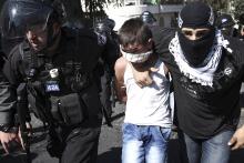 Israeli police detain a Palestinian youth following clashes after Friday prayers in the East Jerusalem neighbourhood of Wadi al-Joz, October 24, 2014. PHOTO BY REUTERS/Finbarr O'Reilly
