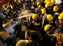 Police use pepper spray during clashes with pro-democracy protesters close to the chief executive office in Hong Kong, November 30, 2014. PHOTO BY REUTERS/Tyrone Siu